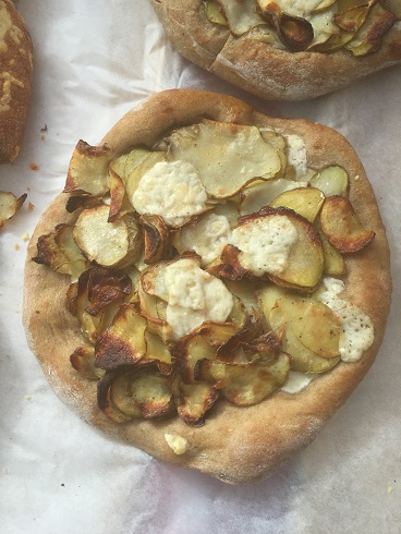 kernza, potato,mozz, tellegio pie with truffle oil
